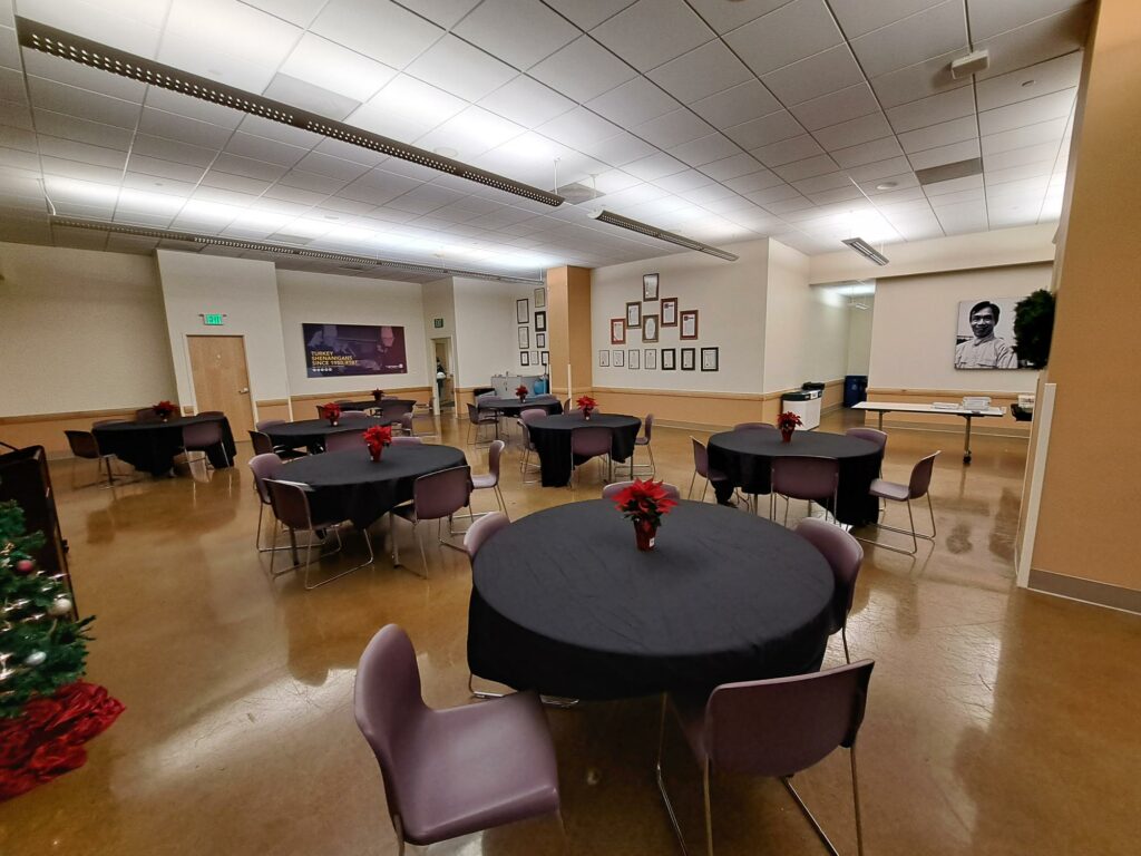 Poverello room set up with round banquet tables