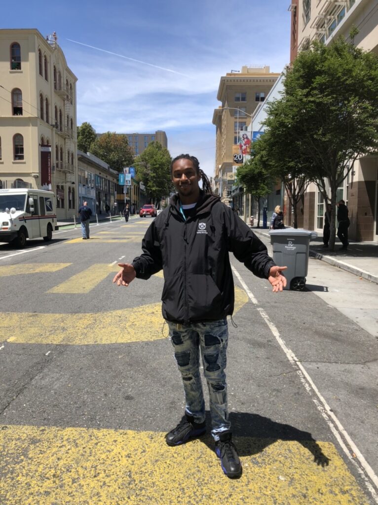 Community Safety Services staff member and Father Alfred Center graduate Danny Green poses in the middle of Golden Gate Avenue