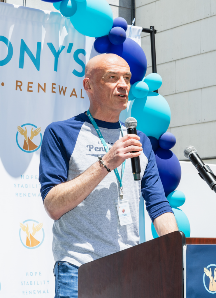 St. Anthony's CEO Nils Behnke speaks at a podium at the 45th Annual Penny PItch