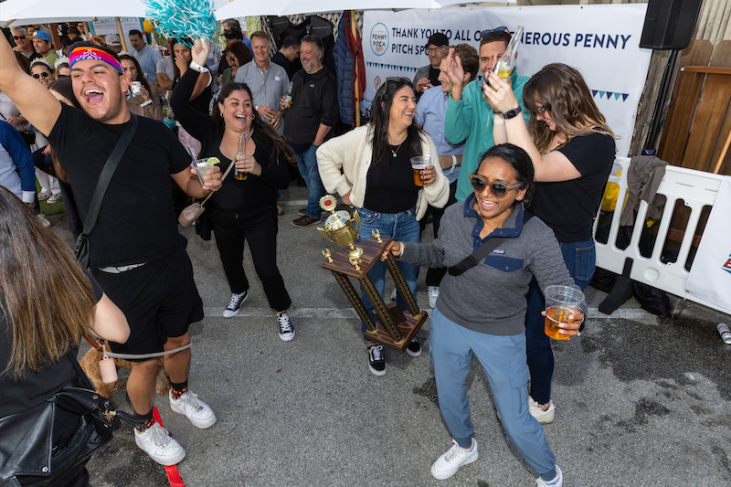 Runners up celebrate with their second place trophy at the 45th Annual Penny Pitch