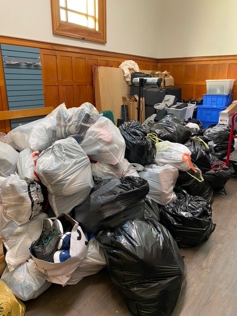 Room filled with Free Clothing Program donations