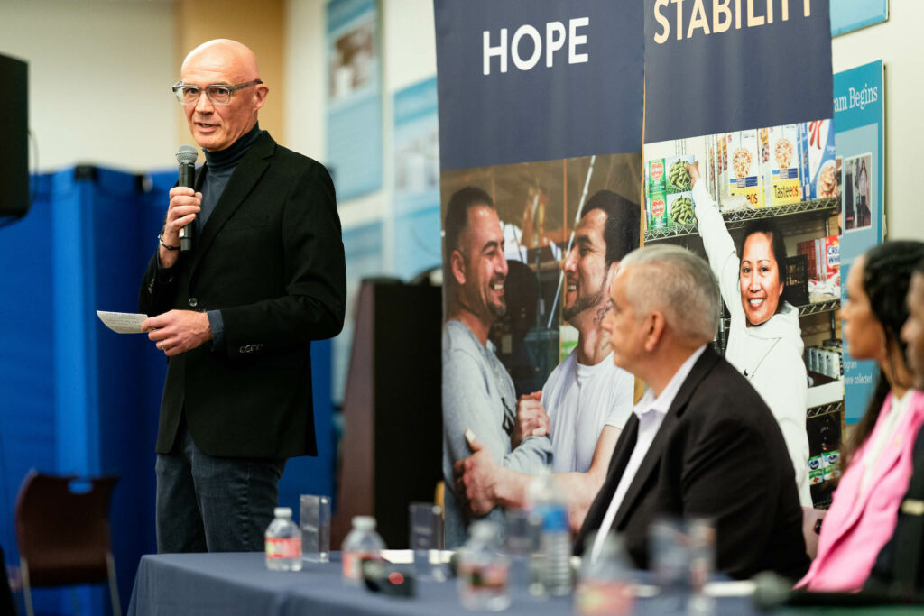 Nils Behnke delivering opening remarks at a Town Hall hosted by St. Anthony Foundation on August 3, 2023.